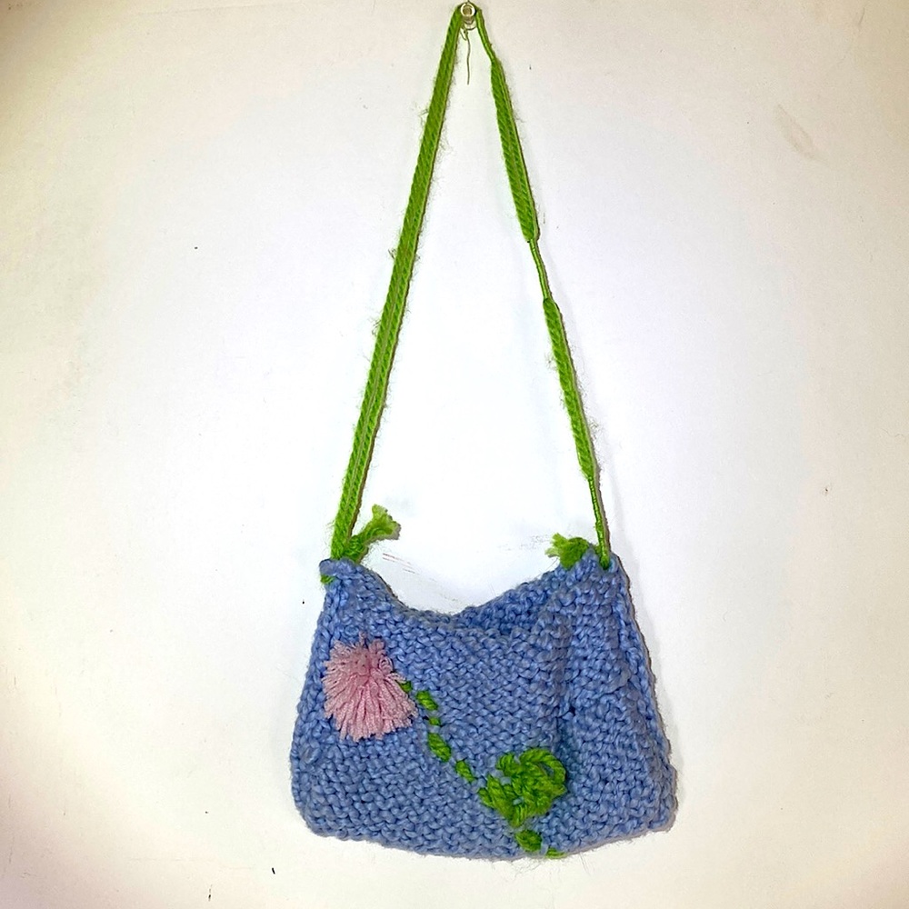 Light blue, hand knitted hand bag. Small (see soda can for reference)